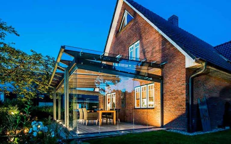 Ampliación de vivienda con cerramiento de cristal